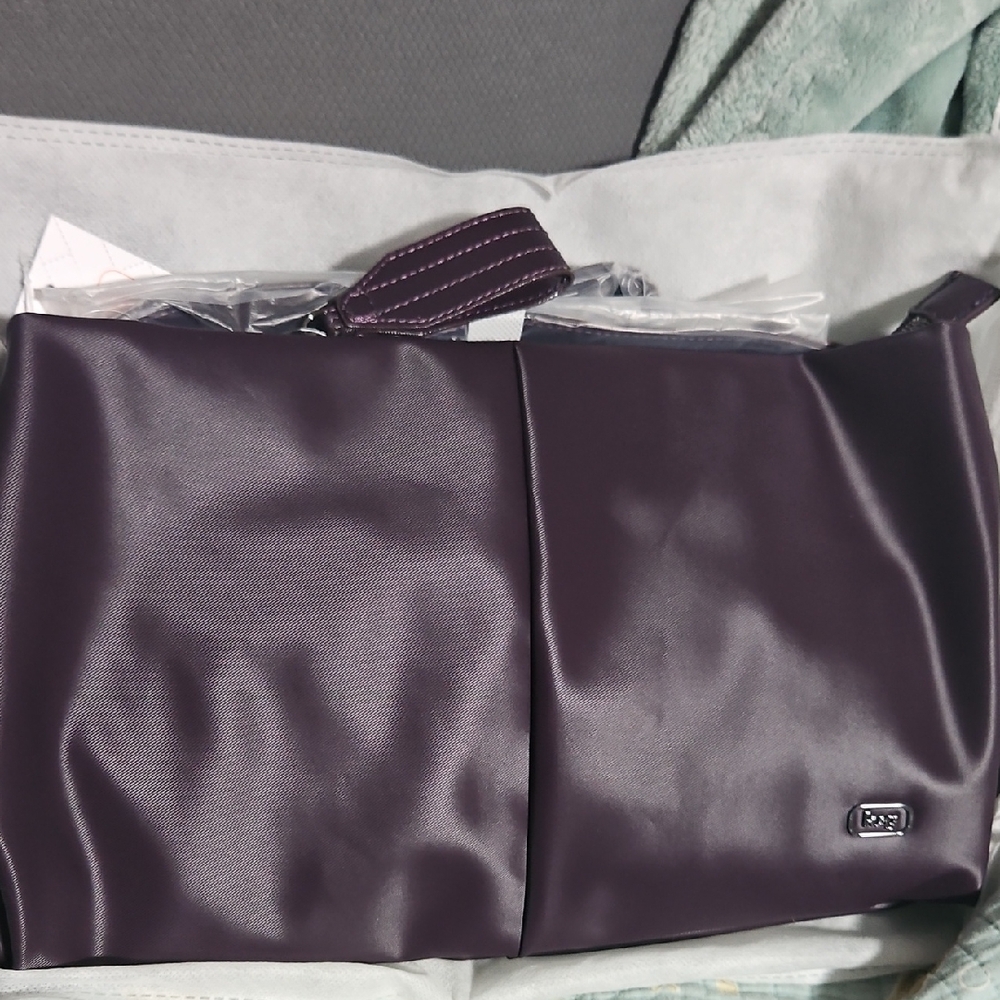 LUG HALF PLUNGE PLUM Bag CROSSBODY. NWT NON SMOKING/PET FRIENDLY HOME.